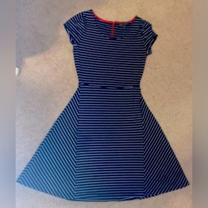 Outback Red dress, snug on top, flared on the bottom, right above knee length.